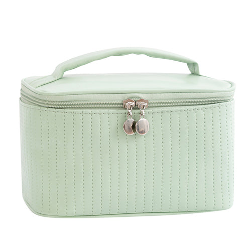 Light Green Ritual Case cosmetic bag, front view with top handle and zip closure